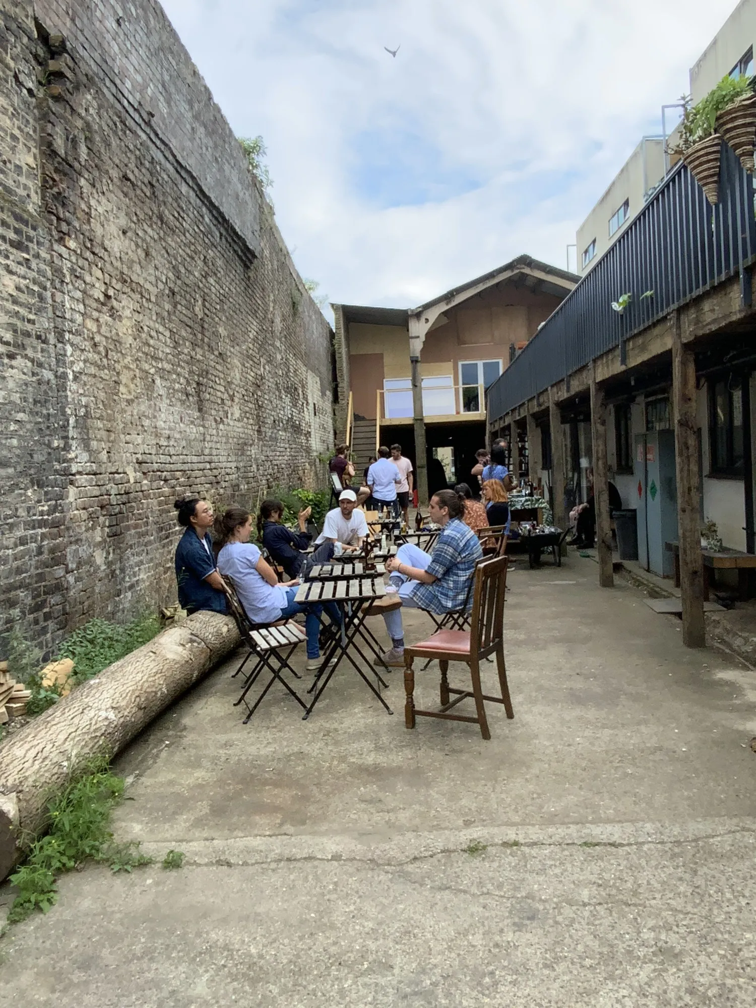 Members gathered in the courtyard at Hone Limehouse