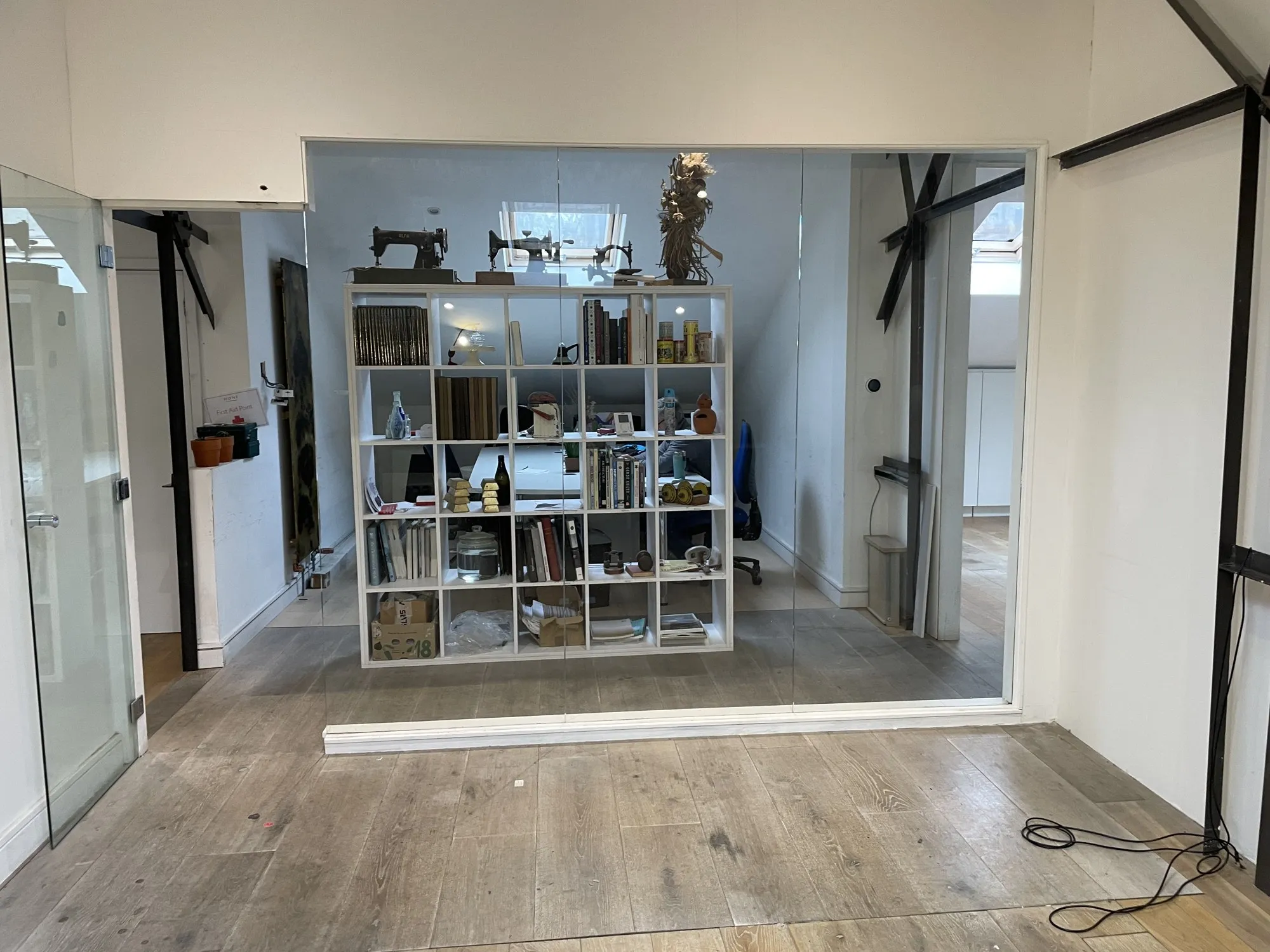 A sewing machine on a shelving divider, in a fashion studio at Hone Limehouse